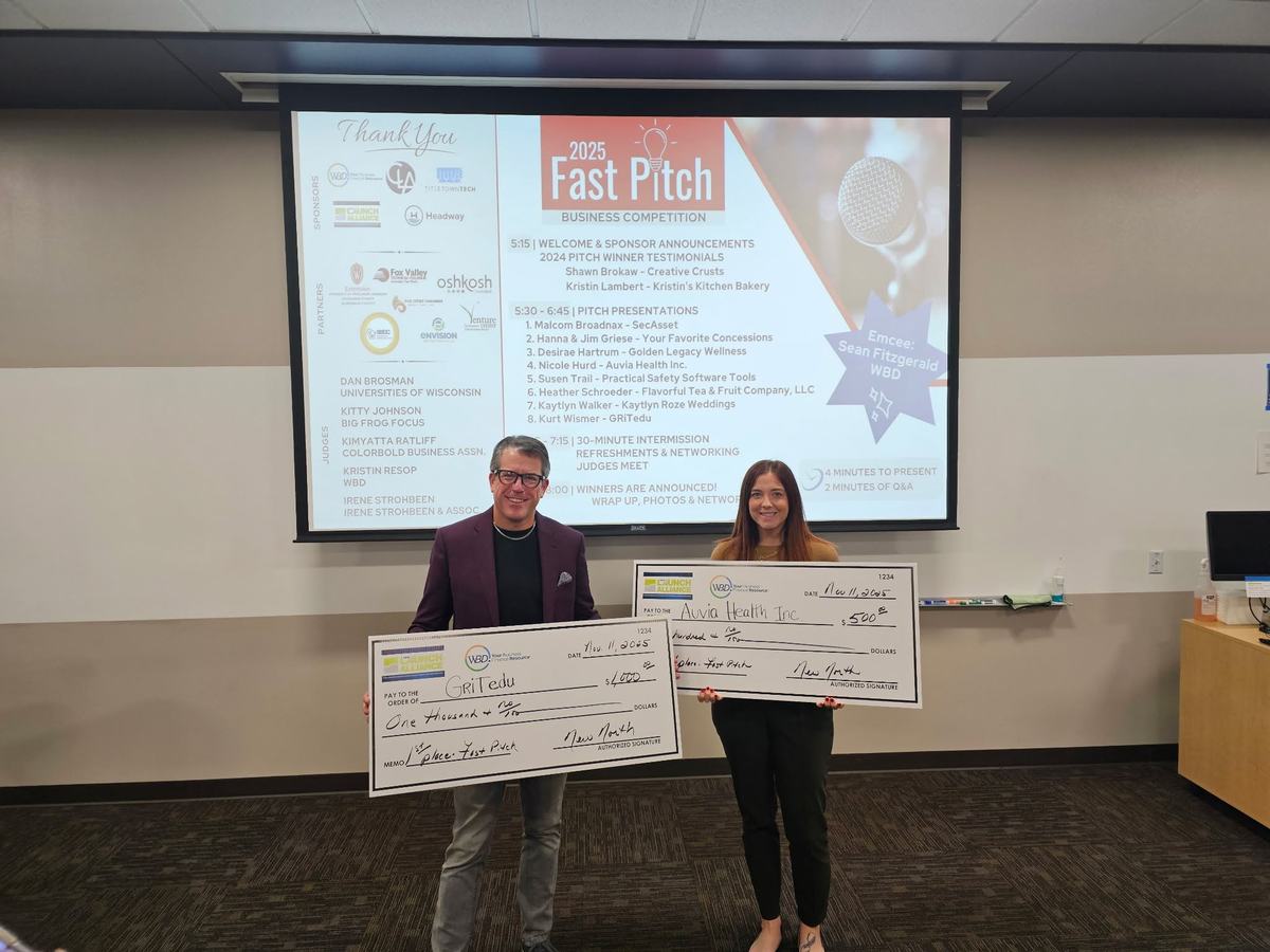 GRiTedu accepting a first-place Fast Pitch check